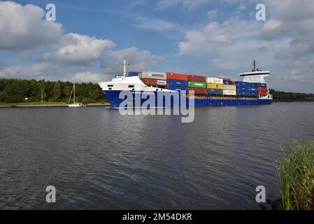 Container ship Heinrich Schepers sails through the Kiel Canal, Schleswig-Holstein, Germany Stock Photo