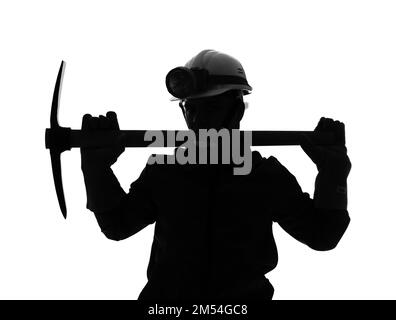 Silhouette of male miner with pick on white background Stock Photo