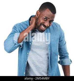 My neck is so sore. Studio portrait of a young man holding his neck in pain against a white background. Stock Photo