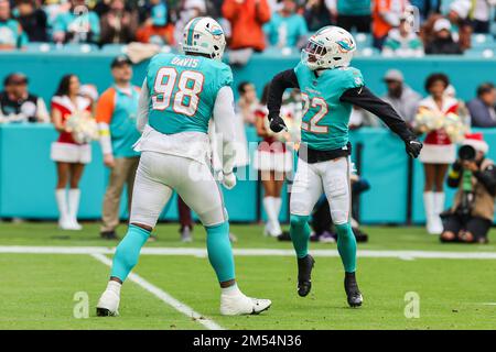 Miami. FL USA;  Miami Dolphins safety Elijah Campbell (22) and defensive tackle Raekwon Davis (98) celebrate after tackling Green Bay Packers cornerba Stock Photo