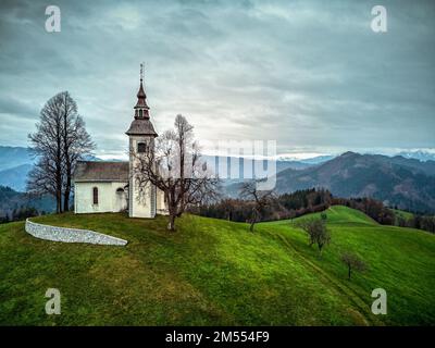 Aerial view of Saint Thomas Church. Photo was taken on 30th of November 2022 in the town of Skofja Loka, Upper Carniola region, Slovenia. Stock Photo