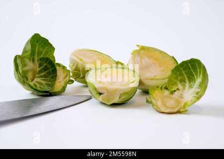selected focus Brussel sprout with knife blade isolated on a white background Stock Photo