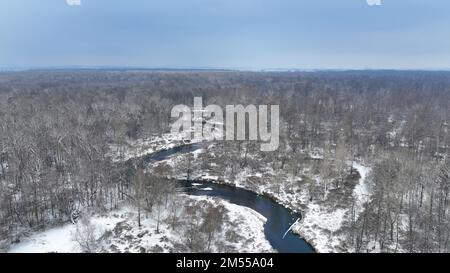 River delta floodplain winter snow meander drone aerial inland video shot in sandy sand alluvium freezing cold frost, benches forest and lowlands wetl Stock Photo