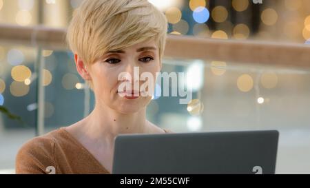 Portrait headshot adult caucasian 40s middle-aged woman programmer journalist manager CEO user professional with laptop shopping online payment net Stock Photo
