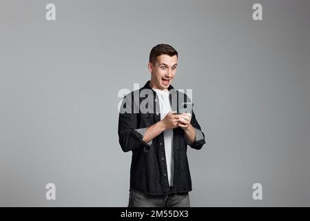 handsome man with mobile cell phone surfing internet Stock Photo