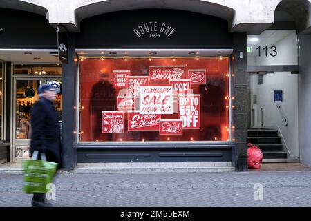 Edinburgh, Scotland, UK. 26th December 2022. Although many high street shops remain closed until tomorrow some open for Boxing day Sales, hoping to pick up available customer footfall. 65% off at Route One, Rose Street. Credit: Craig Brown/Alamy Live News Stock Photo