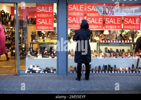 Edinburgh, Scotland, UK. 26th December 2022. Although many high street shops remain closed until tomorrow some open for Boxing day Sales, hoping to pick up available customer footfall. 10% off at Rogerson shoe shop, Rose Street. Credit: Craig Brown/Alamy Live News Stock Photo