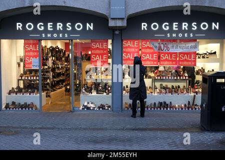 Edinburgh, Scotland, UK. 26th December 2022. Although many high street shops remain closed until tomorrow some open for Boxing day Sales, hoping to pick up available customer footfall. 10% off at Rogerson shoe shop, Rose Street. Credit: Craig Brown/Alamy Live News Stock Photo