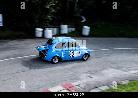 A blue Fiat 500 abarth retro racing car on the road in San Bartolo park. Pesaro, Italy. Stock Photo