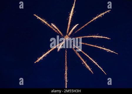 An explosion of bright single fireworks, against the background of the night sky. High quality photo Stock Photo
