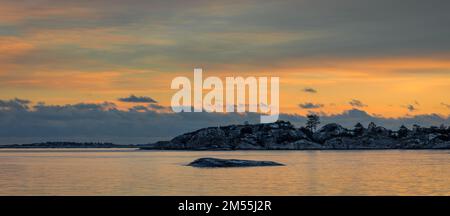 Colorful sunset seascape ,panorama with clouds and islands silhouette. Stock Photo