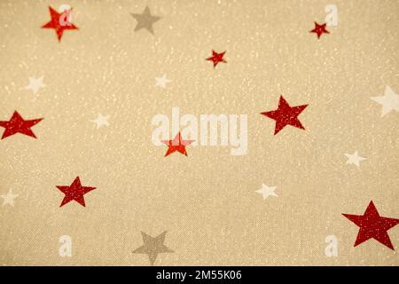 Beige natural fabric sequins and stars. Christmas background Stock Photo