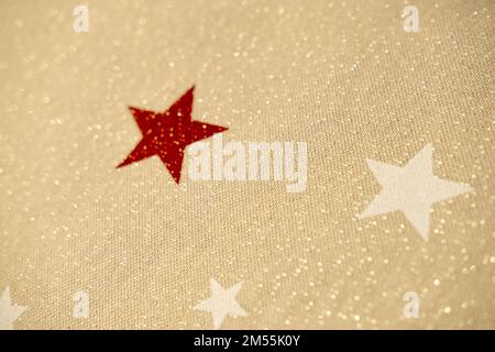 Beige natural fabric sequins and stars. Christmas background Stock Photo