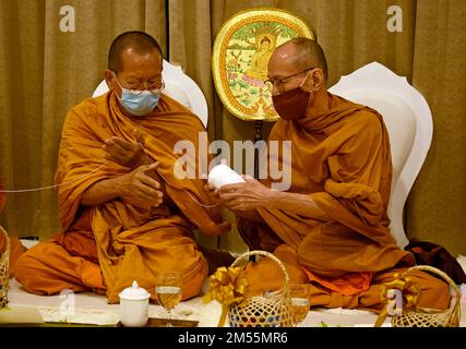 Thai monks hold a 