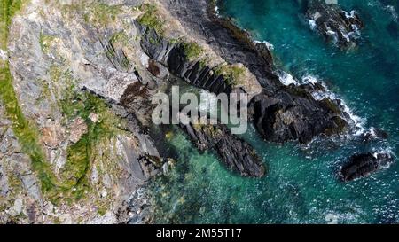 Epic cliffs of Ireland. The picturesque coast of the Celtic Sea, West Cork. Seascape, top view. Drone photo. Stock Photo