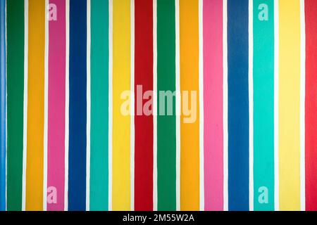 Multicolor vertical striped pattern on cement wall. Colorful painted on cement surface of the wall. Graffiti in the colors of rainbow. Colour full of Stock Photo