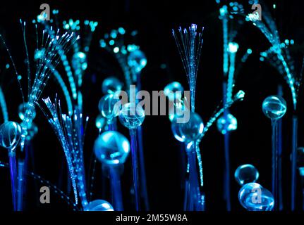 Blue fiber optic strands or filaments creating a magic fantastic abstract background Stock Photo