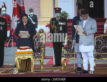 Kathmandu, Bagmati, Nepal. 26th Dec, 2022. Nepal's newly elected Prime Minister Pushpa Kamal Dahal(R) administers the oath of office in the presence of the President Bidhya Devi Bhandari (L) and the outgoing Prime Minister Sher Bahadur Deuba (R, back) at the presidential office in Kathmandu, Nepal on December 26, 2022. (Credit Image: © Sunil Sharma/ZUMA Press Wire) Stock Photo