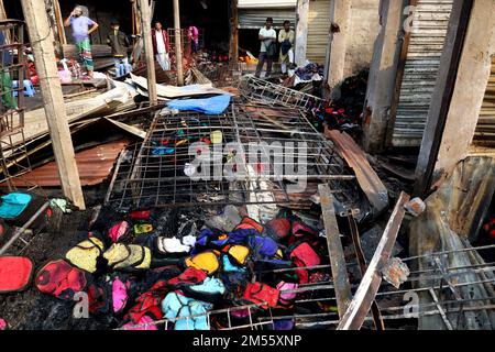 Gazipur, Gazipur, Bangladesh. 26th Dec, 2022. A fire broke out at a wholesale Fabric market at Chandana Chowrasta in Gazipur city on the night of 25th December. The fire came under control with the efforts of 10 units of fire services. Around 100 shops and clothes were completely destroyed. (Credit Image: © Syed Mahabubul Kader/ZUMA Press Wire) Credit: ZUMA Press, Inc./Alamy Live News Stock Photo