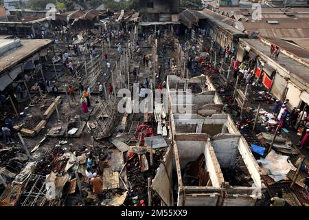 Gazipur, Gazipur, Bangladesh. 26th Dec, 2022. A fire broke out at a wholesale Fabric market at Chandana Chowrasta in Gazipur city on the night of 25th December. The fire came under control with the efforts of 10 units of fire services. Around 100 shops and clothes were completely destroyed. (Credit Image: © Syed Mahabubul Kader/ZUMA Press Wire) Credit: ZUMA Press, Inc./Alamy Live News Stock Photo