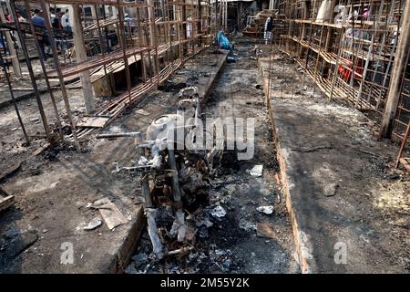 Gazipur, Gazipur, Bangladesh. 26th Dec, 2022. A fire broke out at a wholesale Fabric market at Chandana Chowrasta in Gazipur city on the night of 25th December. The fire came under control with the efforts of 10 units of fire services. Around 100 shops and clothes were completely destroyed. (Credit Image: © Syed Mahabubul Kader/ZUMA Press Wire) Credit: ZUMA Press, Inc./Alamy Live News Stock Photo