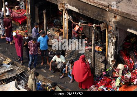 Gazipur, Gazipur, Bangladesh. 26th Dec, 2022. A fire broke out at a wholesale Fabric market at Chandana Chowrasta in Gazipur city on the night of 25th December. The fire came under control with the efforts of 10 units of fire services. Around 100 shops and clothes were completely destroyed. (Credit Image: © Syed Mahabubul Kader/ZUMA Press Wire) Credit: ZUMA Press, Inc./Alamy Live News Stock Photo