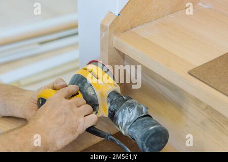 Grinding handrails with using polishing machine refinishing stairwell ...