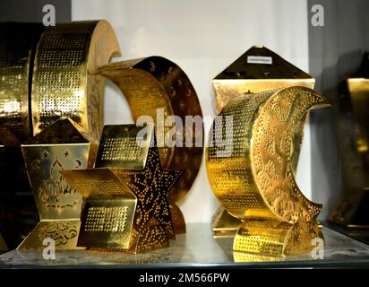 Golden metal Islamic Ramadan lanterns and crescent moon shape, Fanous Ramadan or lamp that is a festive icon of the fasting month for Muslims, selecti Stock Photo