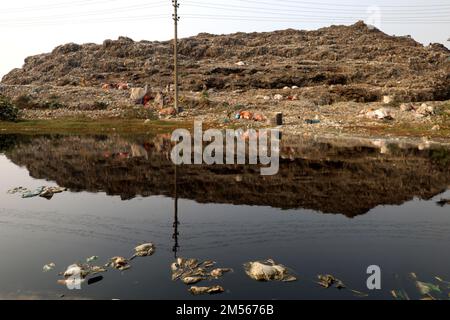 Gazipur, Gazipur, Bangladesh. 26th Dec, 2022. A pile of garbage like a mountain near Gazipur city. All the garbage of Gazipur City Corporation area is dumped here. Hundreds of tons of garbage are dumped every day. These wastes are polluting the environment very badly. Methane gas released from these wastes is a big threat to the Ozone layer. (Credit Image: © Syed Mahabubul Kader/ZUMA Press Wire) Stock Photo