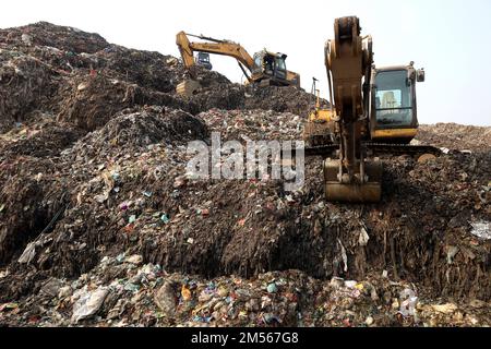 Gazipur, Gazipur, Bangladesh. 26th Dec, 2022. A pile of garbage like a mountain near Gazipur city. All the garbage of Gazipur City Corporation area is dumped here. Hundreds of tons of garbage are dumped every day. These wastes are polluting the environment very badly. Methane gas released from these wastes is a big threat to the Ozone layer. (Credit Image: © Syed Mahabubul Kader/ZUMA Press Wire) Stock Photo