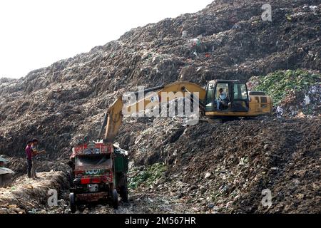 Gazipur, Gazipur, Bangladesh. 26th Dec, 2022. A pile of garbage like a mountain near Gazipur city. All the garbage of Gazipur City Corporation area is dumped here. Hundreds of tons of garbage are dumped every day. These wastes are polluting the environment very badly. Methane gas released from these wastes is a big threat to the Ozone layer. (Credit Image: © Syed Mahabubul Kader/ZUMA Press Wire) Stock Photo