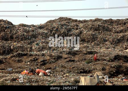 Gazipur, Gazipur, Bangladesh. 26th Dec, 2022. A pile of garbage like a mountain near Gazipur city. All the garbage of Gazipur City Corporation area is dumped here. Hundreds of tons of garbage are dumped every day. These wastes are polluting the environment very badly. Methane gas released from these wastes is a big threat to the Ozone layer. (Credit Image: © Syed Mahabubul Kader/ZUMA Press Wire) Stock Photo