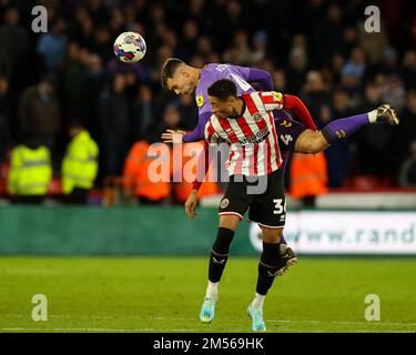 Sheffield, UK. 26th Dec, 2022. Michael Rose #4 of Coventry City beats Daniel Jebbison #36 of Sheffield United to an aerial ball during the Sky Bet Championship match Sheffield United vs Coventry City at Bramall Lane, Sheffield, United Kingdom, 26th December 2022 (Photo by Nick Browning/News Images) in Sheffield, United Kingdom on 12/26/2022. (Photo by Nick Browning/News Images/Sipa USA) Credit: Sipa USA/Alamy Live News Stock Photo