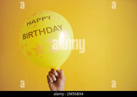 happy birthday test on yellow color Balloons Stock Photo