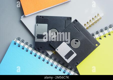 an old vintage floppy disk on a gray background. Stock Photo