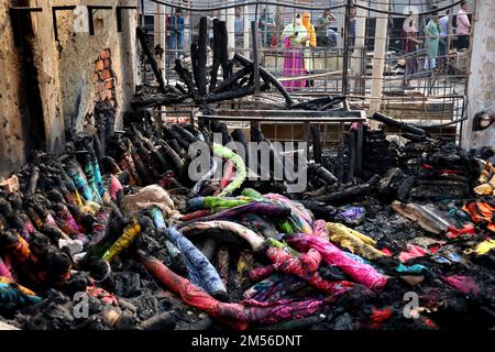 Gazipur, Bangladesh. 26th Dec, 2022. The clean-up begins after a fire broke out at a wholesale Fabric market at Chandana Chowrasta on Christmas Day. Around 100 shops were completely destroyed. (Credit Image: © Syed Mahabubul Kader/ZUMA Press Wire) Credit: ZUMA Press, Inc./Alamy Live News Stock Photo