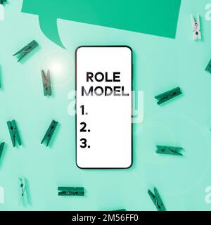 Writing displaying text Role Model. Business overview a person looked to by others as an example to be imitated Stock Photo