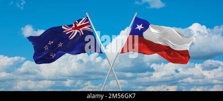 crossed national flags of Chile and New Zealand flag waving in wind at ...
