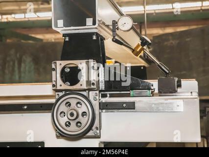 dial gauge attached to unfinished CNC machine to measure axial ratio Stock Photo