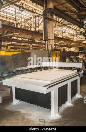 Unfinished new CNC machine in the factory Stock Photo