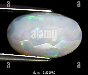 Natural beautiful stone opal on gray background Stock Photo