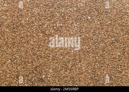 brown pavement lined with tiny round pebbles  Stock Photo