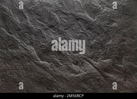 Cracked stone background painted black. Space for text Stock Photo