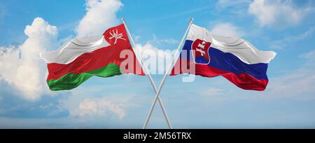 two crossed flags Slovakia and Oman waving in wind at cloudy sky. Concept of relationship, dialog, travelling between two countries. 3d illustration Stock Photo