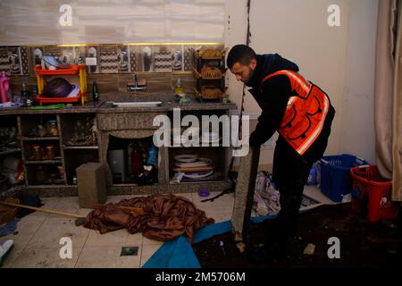 Jabalia, Gaza Strip, Palestine. 26th Dec, 2022. Gaza, Palestine. 26 December 2022. Members of the Palestinian Civil Defence inspect flooded houses in the Jabalia refugee camp in the northern Gaza Strip. A low pressure system gave rise to stormy weather causing disruption in the low area of Jabalia of the Palestinian enclave (Credit Image: © Ahmad Hasaballah/IMAGESLIVE via ZUMA Press Wire) Stock Photo