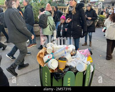 Overflowing garbage recepticles mostly filled with one use coffee cups at Bryant Park in midtown Manhattan. Stock Photo