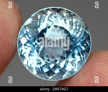 Beautiful natural topaz gemstone on a gray background Stock Photo