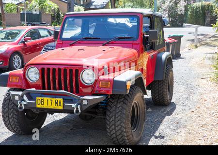 2000 model red Jeep Wrangler 4x4 parked in a side street in Palm Beach,Sydney,NSW,Australia Stock Photo