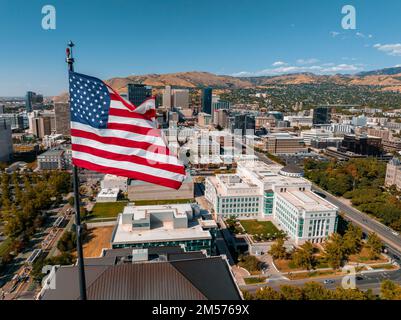 American flag waving on top of the building Stock Photo