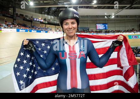 Jennifer Valente of the United States poses with the US flag after winning the women's omnium event at the 2022 UCI Track Cycling World Championships. Stock Photo